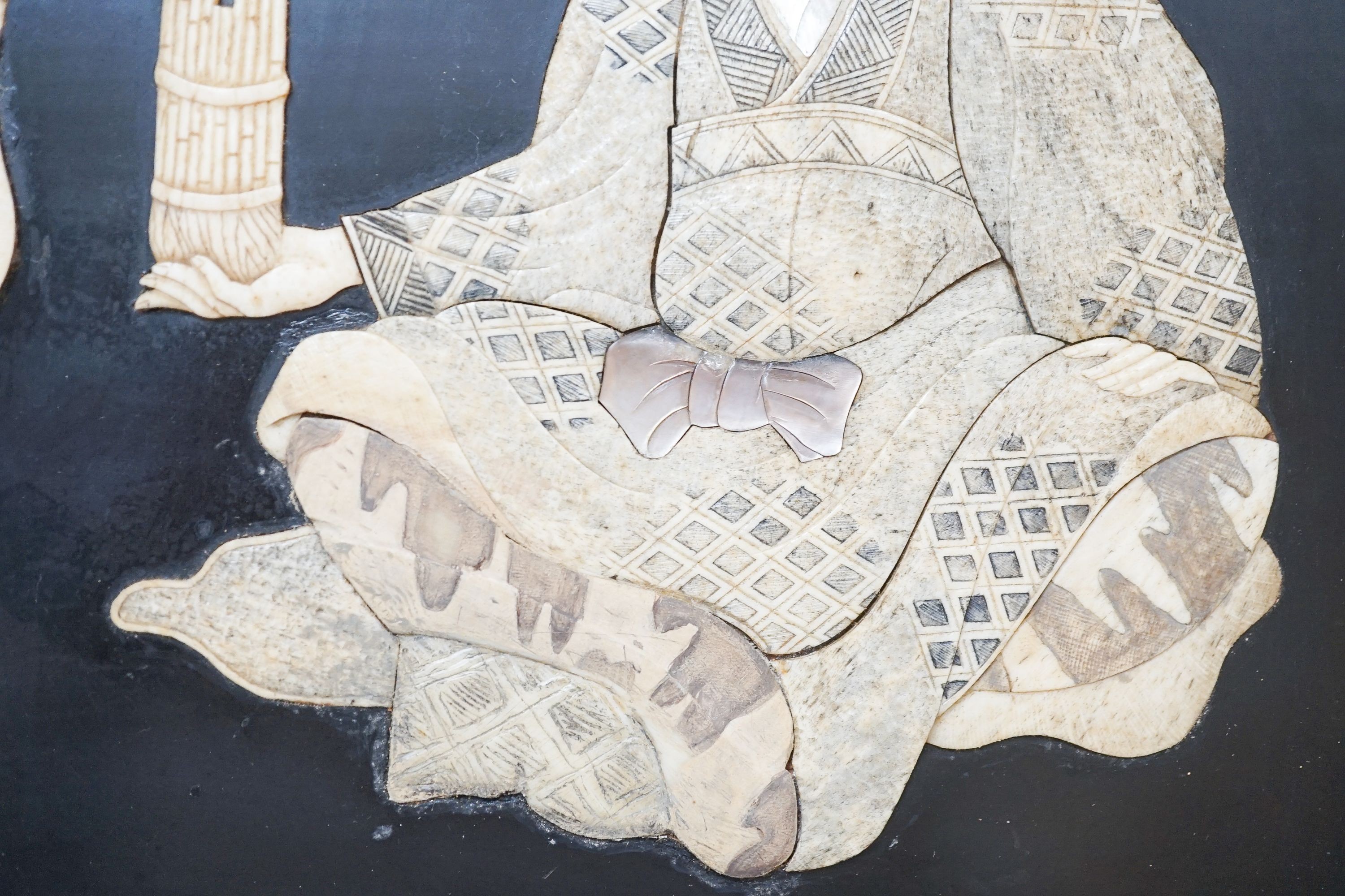 A pair of Japanese Shibayama style ivory, bone and mother of pearl inlaid lacquer panels, Meiji period, depicting two seated men, the other a bijin, 30 x 45cm